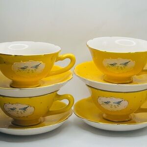 Anthropologie Bluebird tea cup with saucer. Four sets.